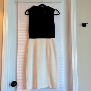 White H.  Black M size 4 fully lined , poly rayon spandex blend, hidden zip